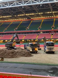 Stadium work diggers prepare muck away