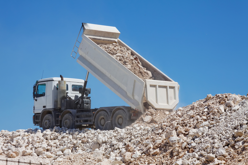 Land reclamation Tipper truck unload rocks